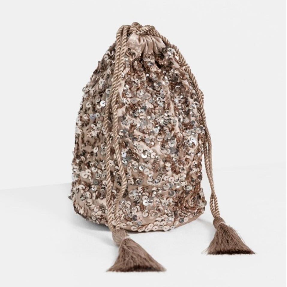 Drawstring bag with sequins on a white background