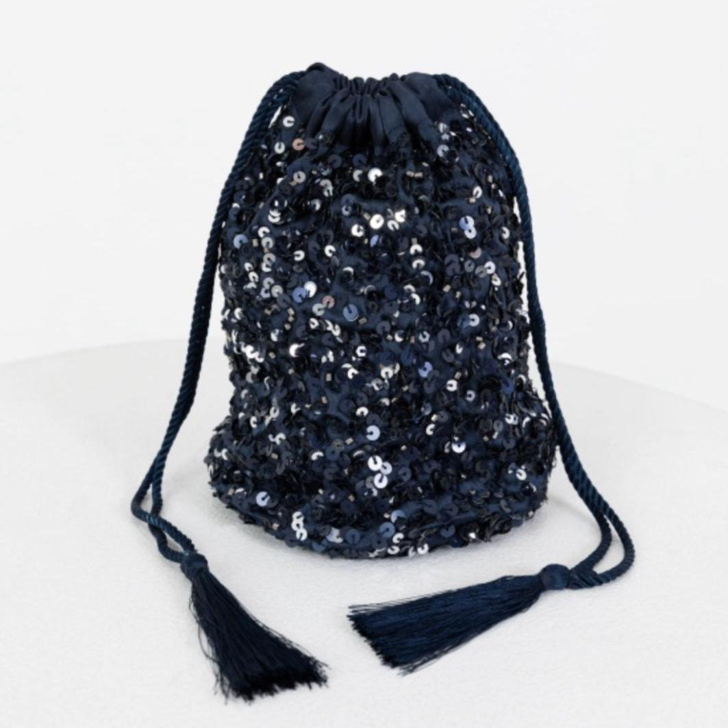 Navy sequin drawstring bag with tassels on a white background