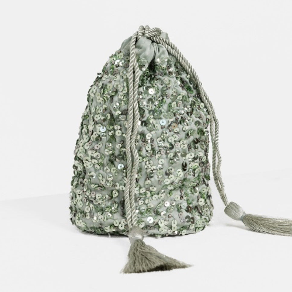 Green sequin drawstring bag on a white background